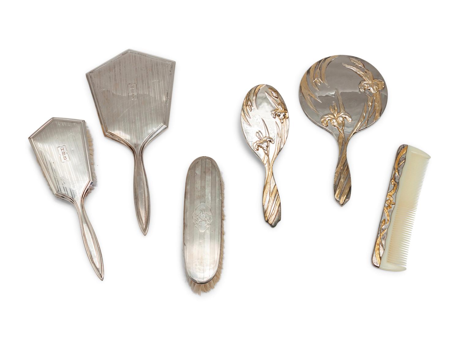A Group of Art Nouveau Silver Dresser Objects Including Mirrors, Brushes and Combs