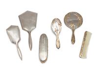 A Group of Art Nouveau Silver Dresser Objects Including Mirrors, Brushes and Combs