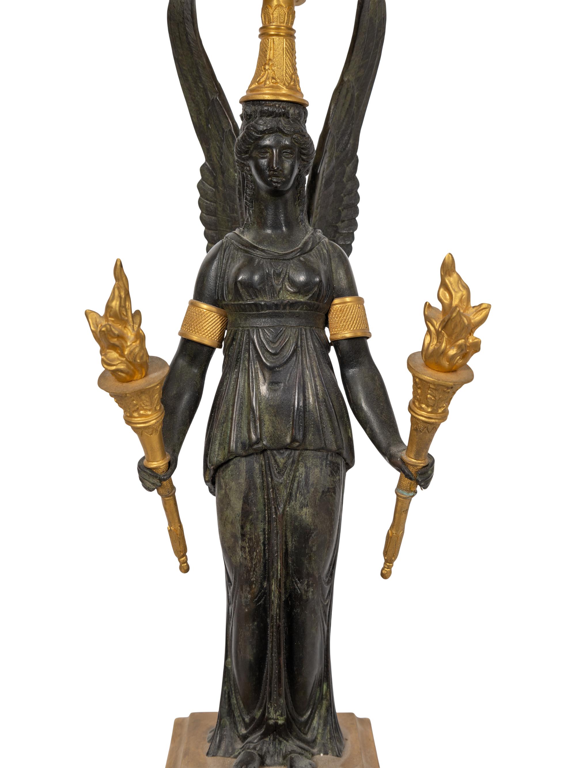 A Pair of Empire Style Gilt and Patinated Bronze Three-Light Candelabra