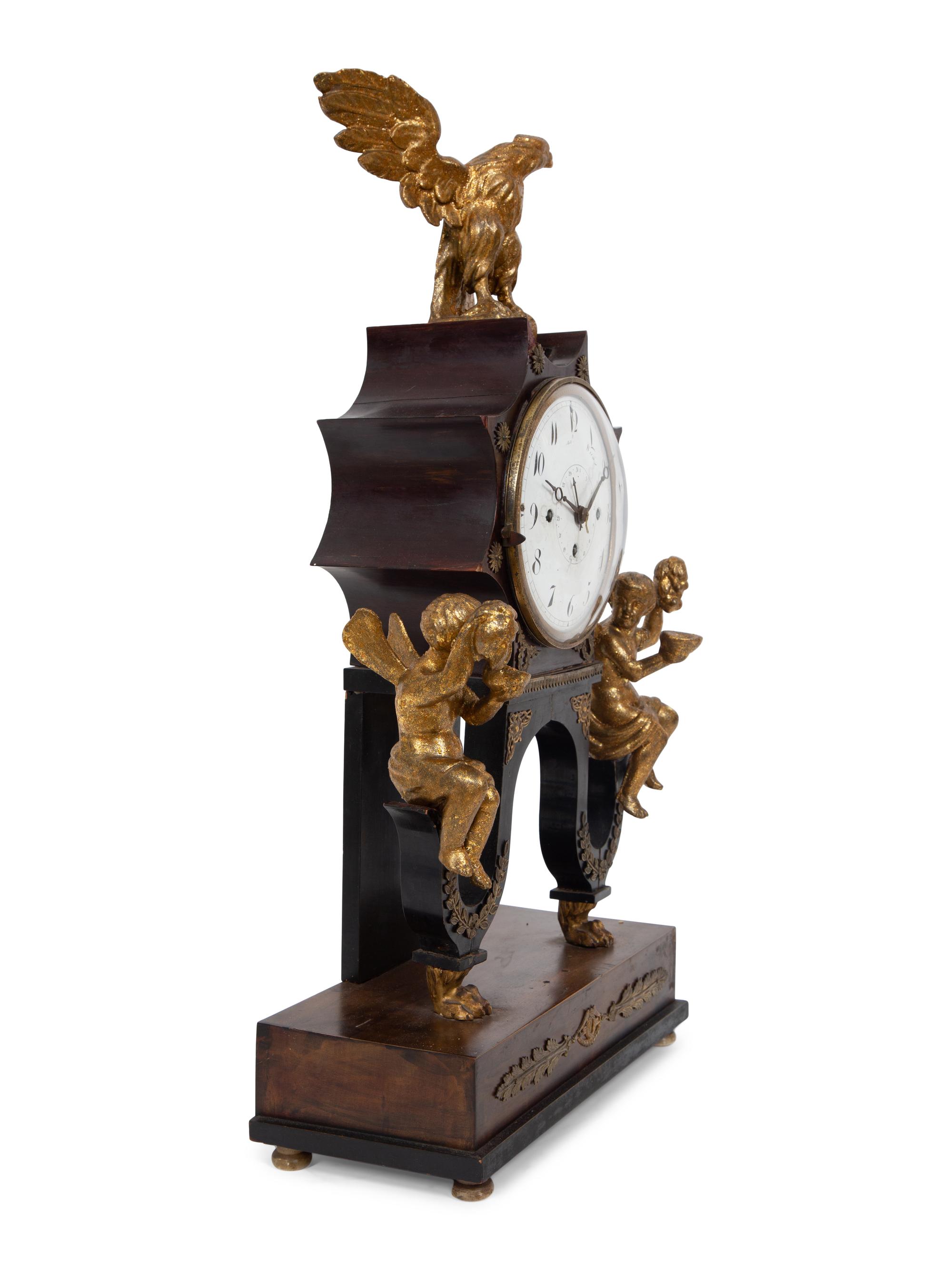 An Austrian Ebonized and Burlwood Mantel Clock with Gilt Metal and Giltwood Mounts