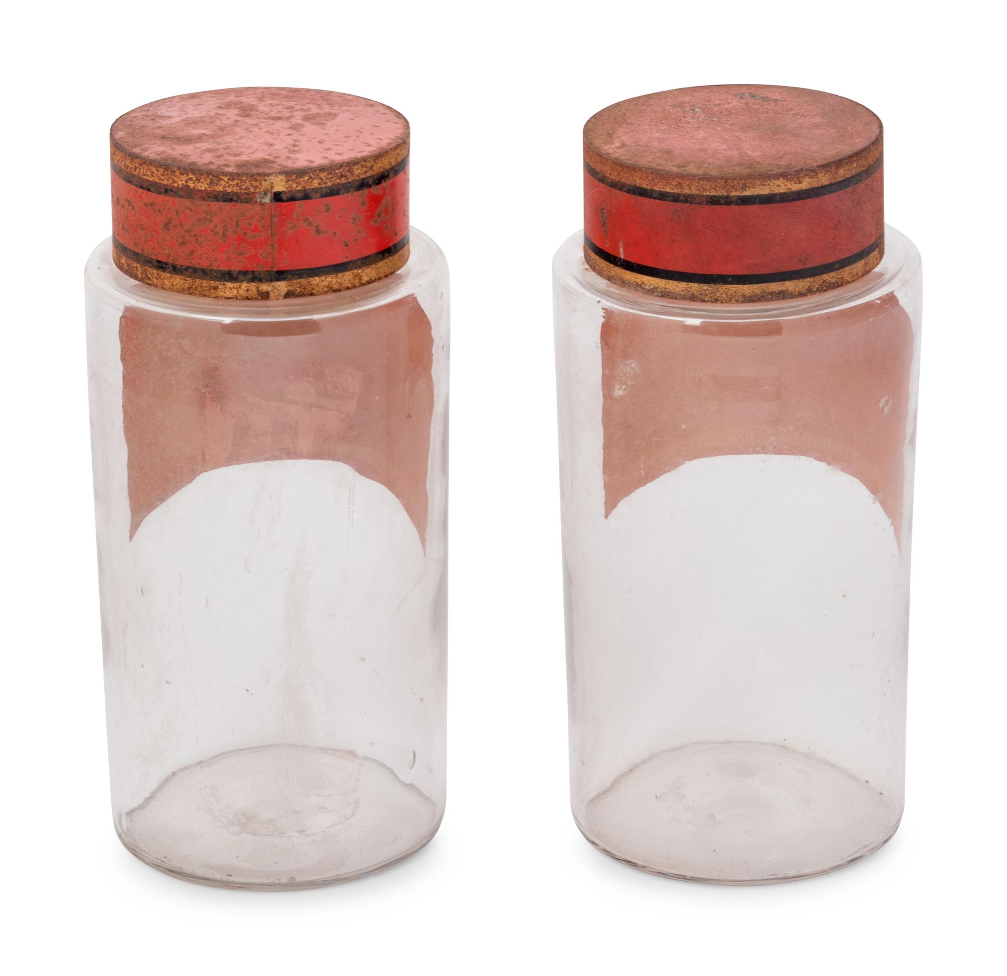 A Pair of Clear Glass Apothecary Jars
