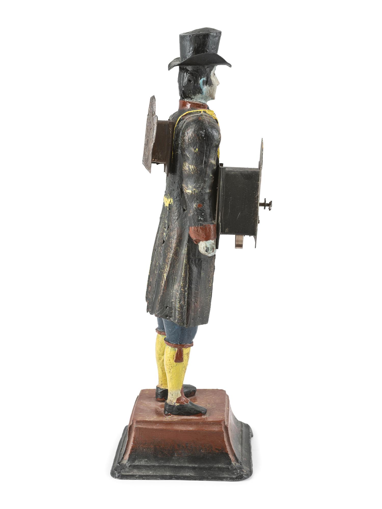 A Painted Cast-Iron 'Clock Peddler' Figural Desk Clock