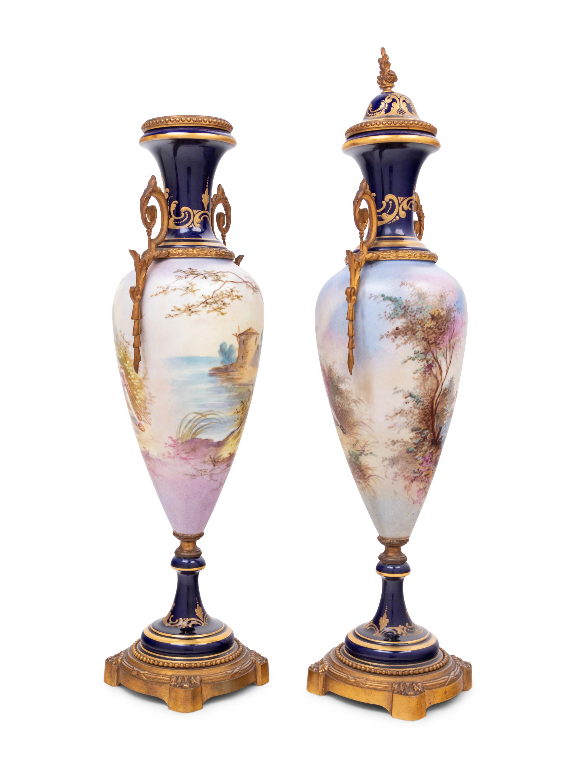 A Pair of Sèvres Style Gilt Metal Mounted Porcelain Urns