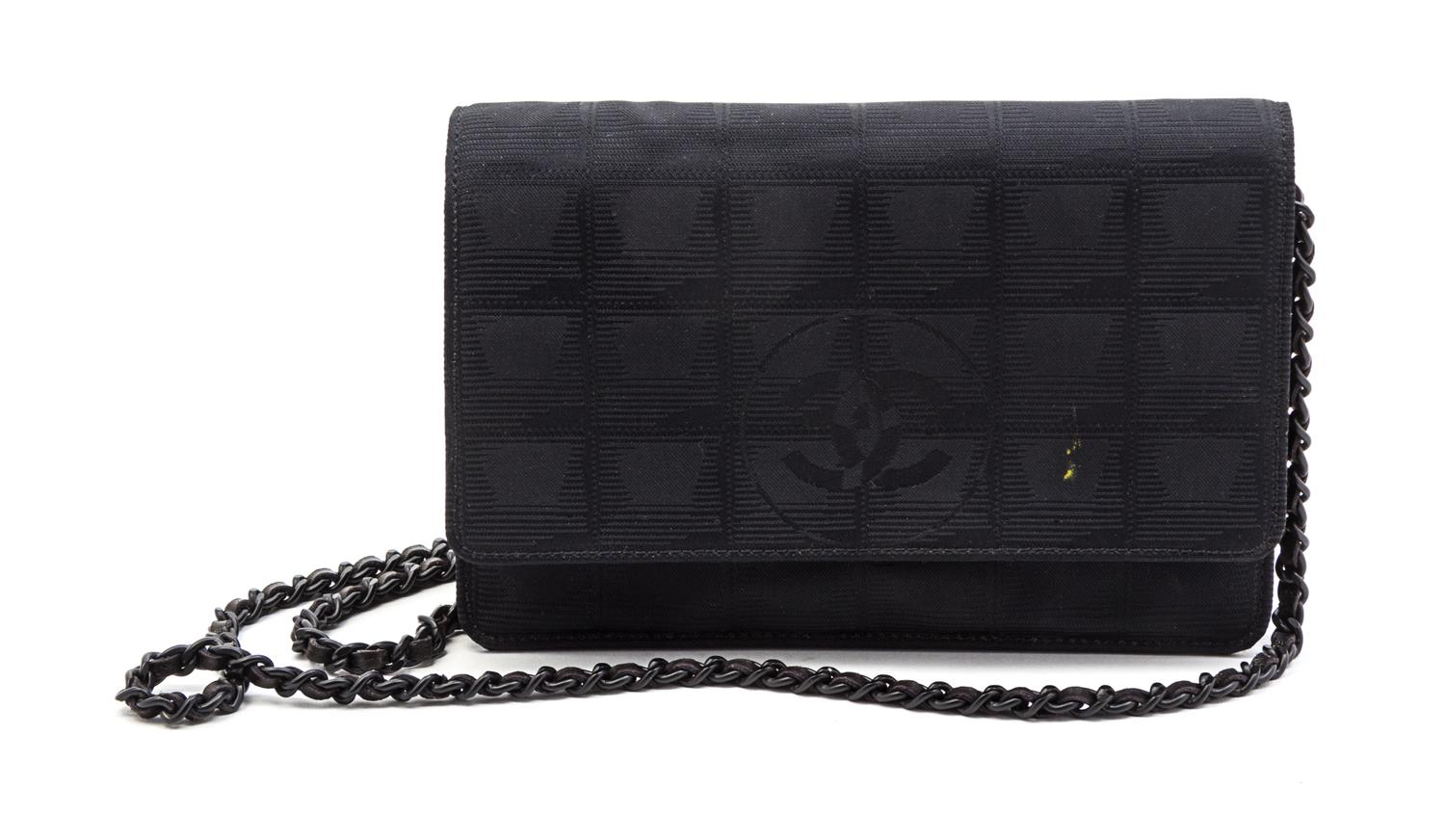 A Chanel Black Canvas Travel Line Wallet on a Chain, 7 x 5 1/2 x 1 inches.