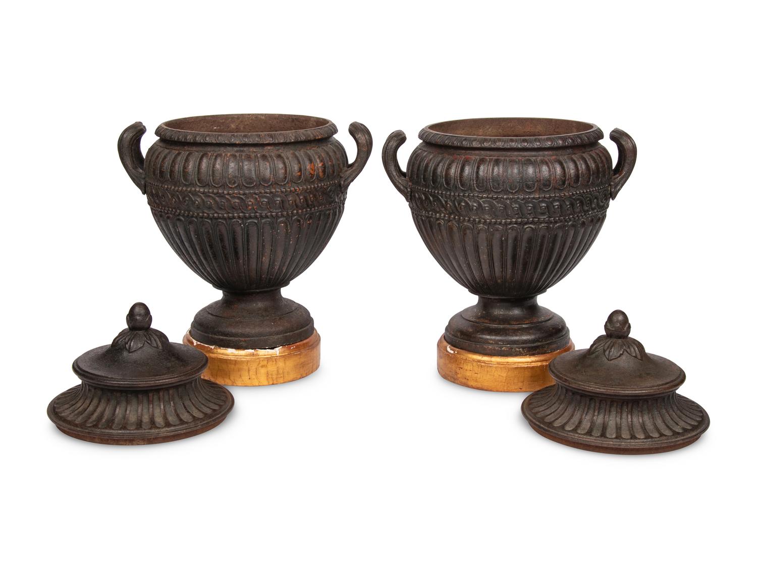 A Pair of Continental Cast Iron Urns