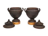 A Pair of Continental Cast Iron Urns