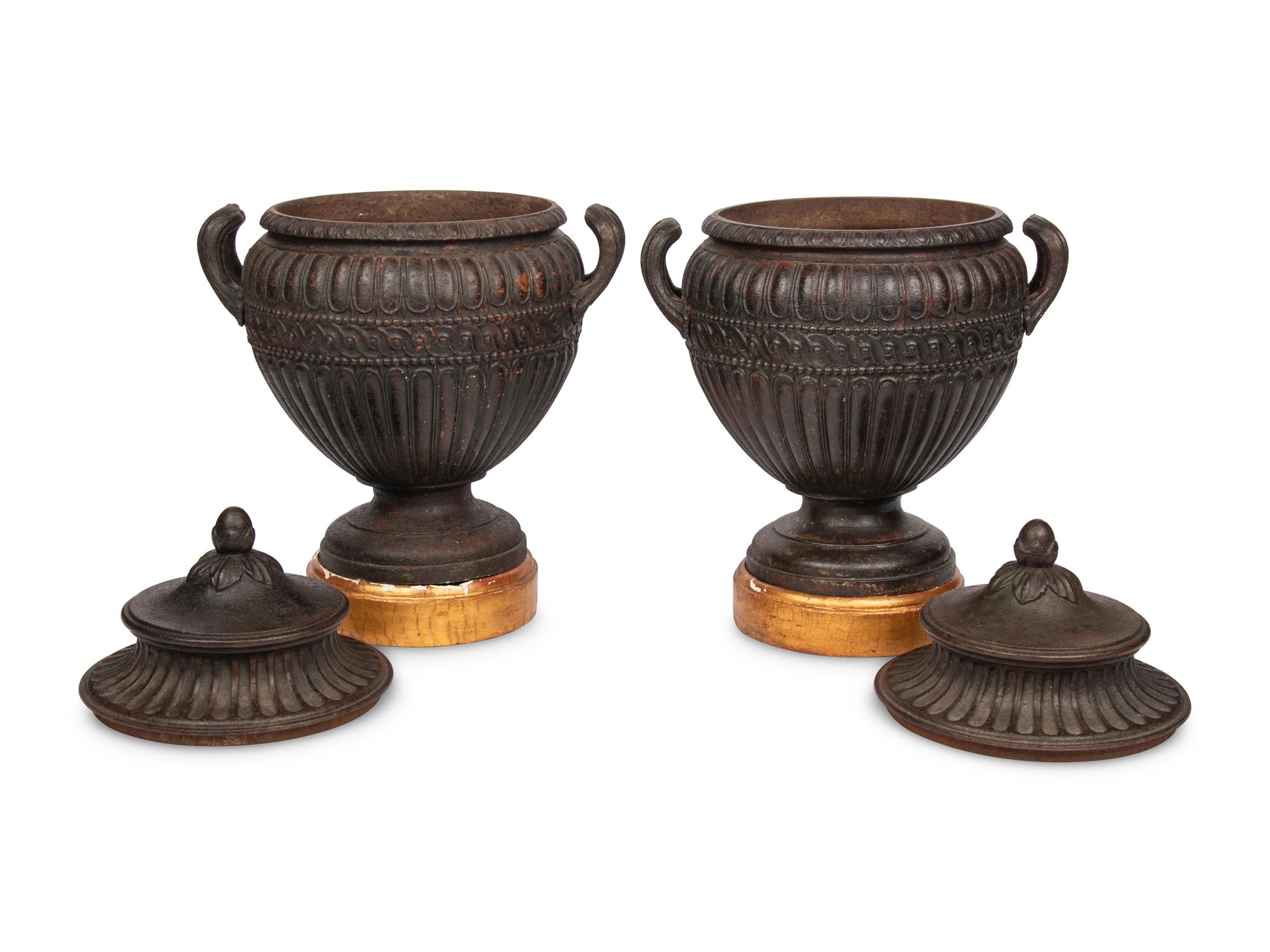 A Pair of Continental Cast Iron Urns