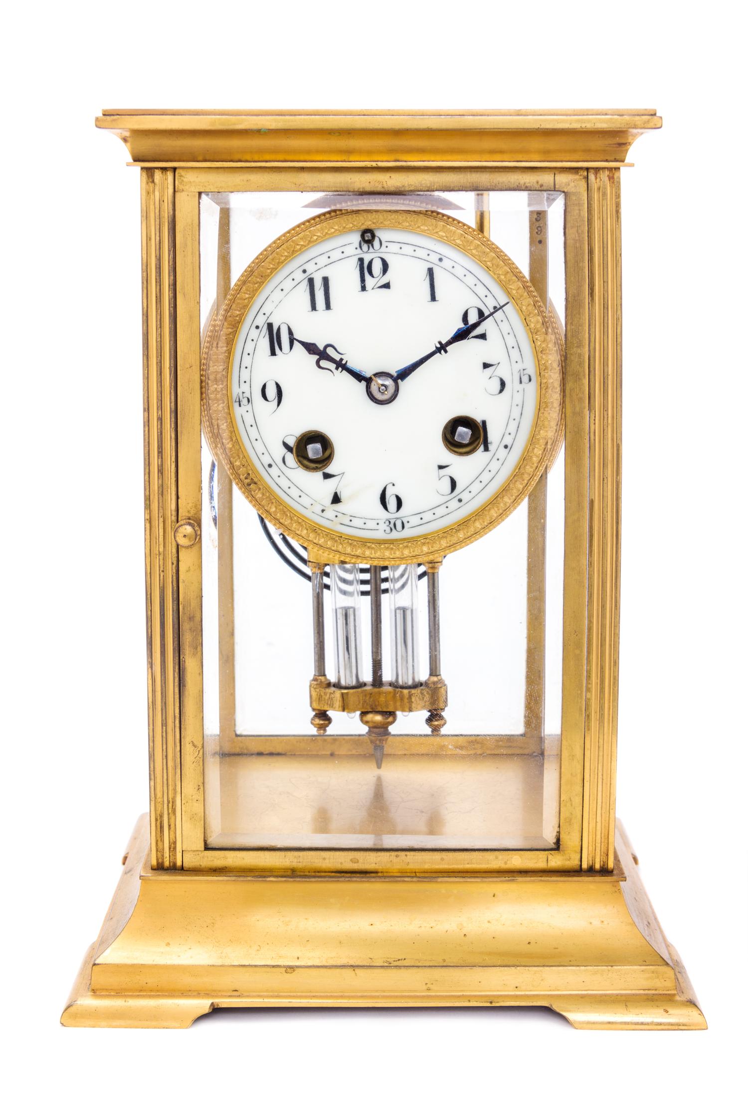 A French Gilt Metal Regulator Clock Height 8 3/4 inches. — 19TH/20TH CENTURY