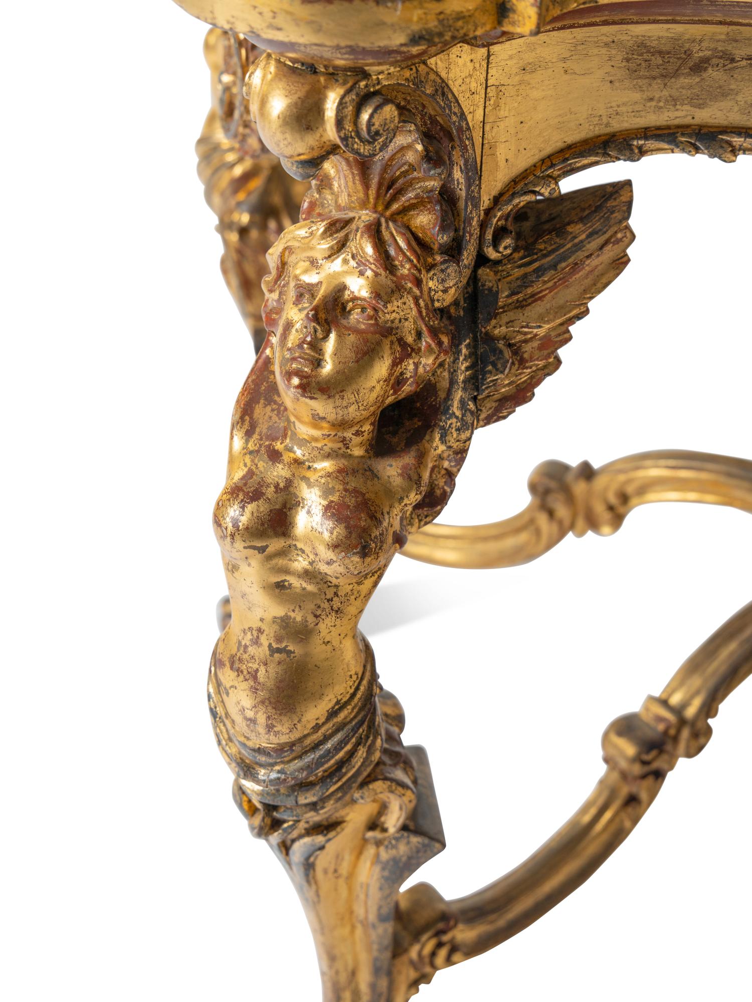 A Continental Rococo Style Giltwood Onyx-Top Table