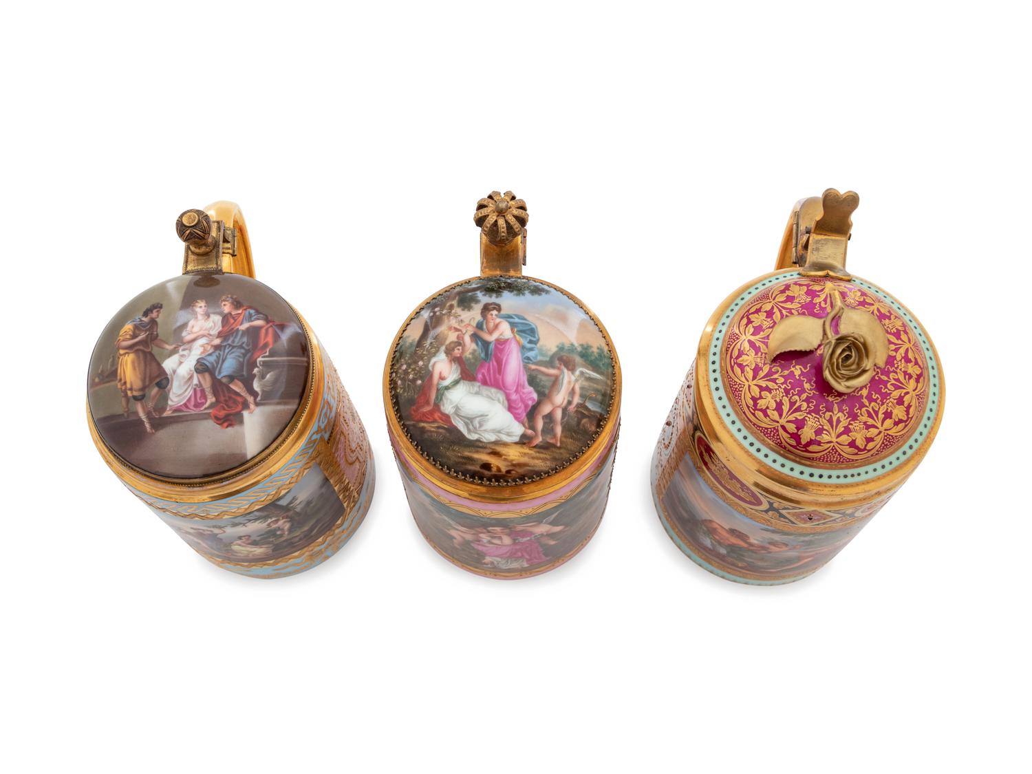 Three Vienna Painted and Parcel Gilt Porcelain Tankards