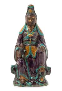 A Chinese Fahua Stoneware Figure of Avalokitesvara MING DYNASTY Height 16 1/4 inches. — MING DYNASTY