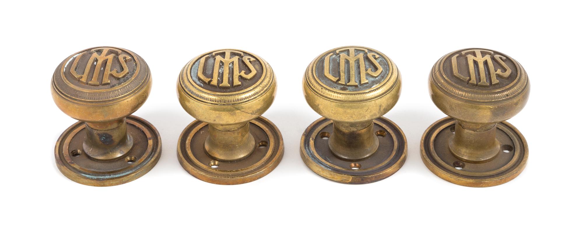Clarence Hatzfeld, (American, 1873-1945), a set of four interior monogrammed door knobs from the Logan Square Masonic Temple, Chicago,