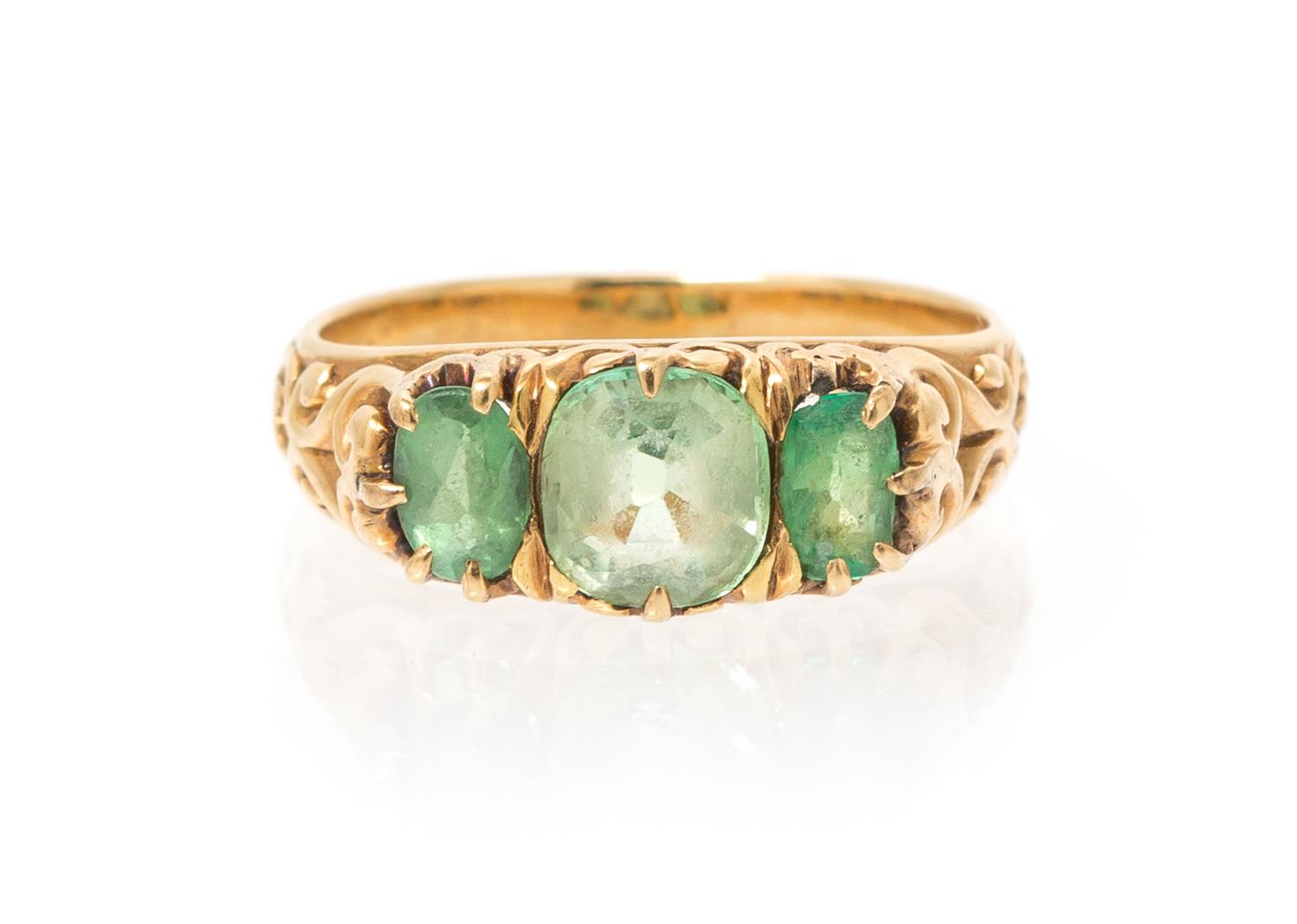 An Antique 18 Karat Yellow Gold, Peridot and Emerald Ring, 2.80 dwts.