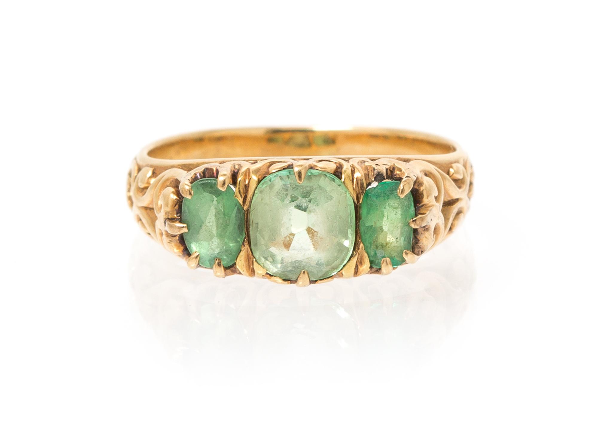 An Antique 18 Karat Yellow Gold, Peridot and Emerald Ring, 2.80 dwts.