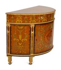 A Pair of Adam Style Painted Parcel Gilt and Marquetry Inlaid Demilune Commodes
