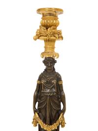 A Pair of French Gilt and Patinated Bronze Figural Candlesticks
