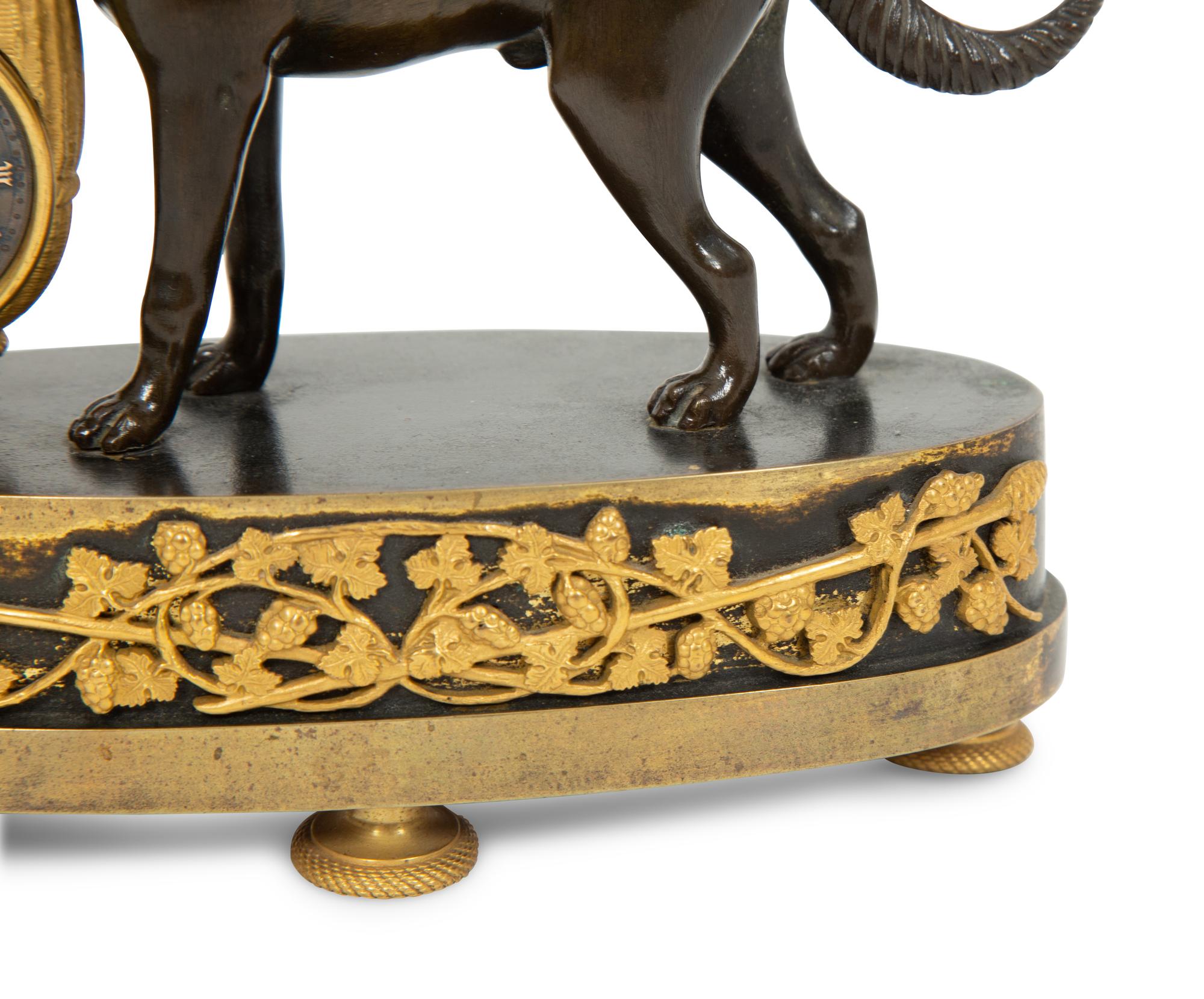 A Small French Gilt and Patinated Bronze Dog Clock