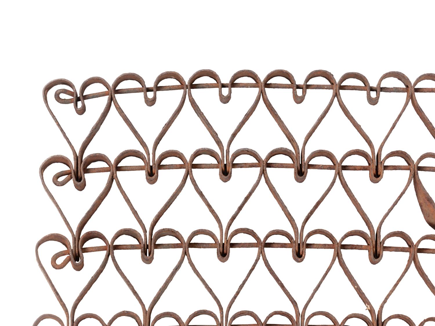 A Wrought-Iron Linked Heart Floor Mat