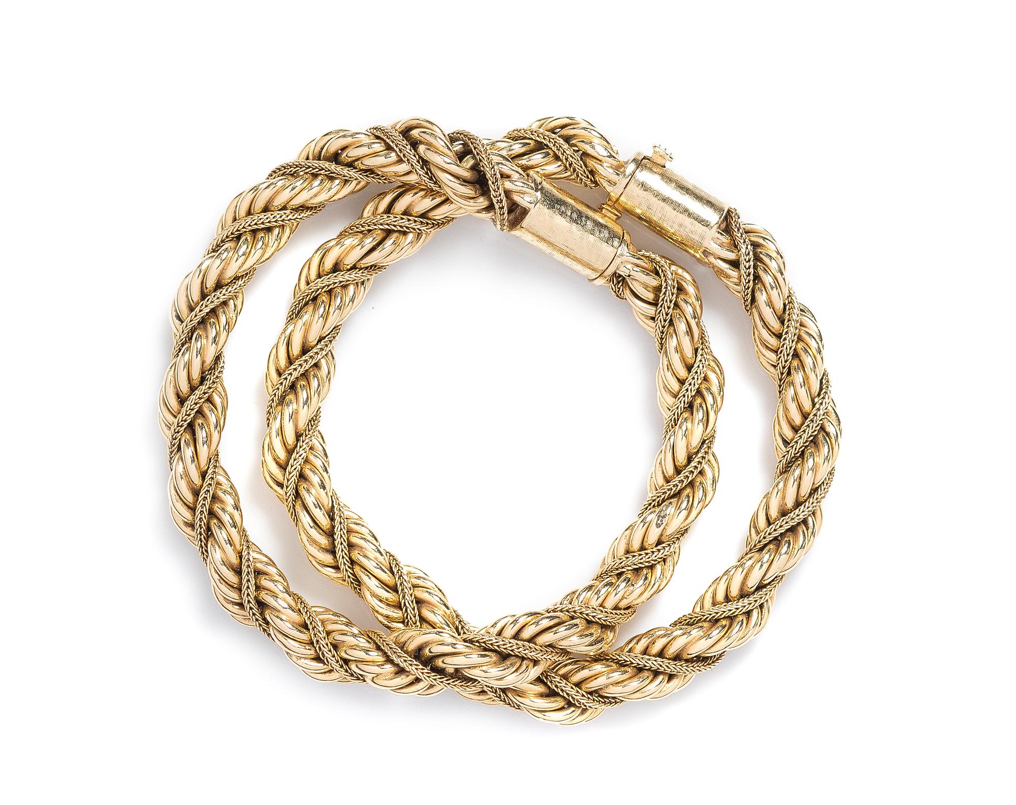 A Pair of 14 Karat Yellow Gold Bracelets, 26.10 dwts.
