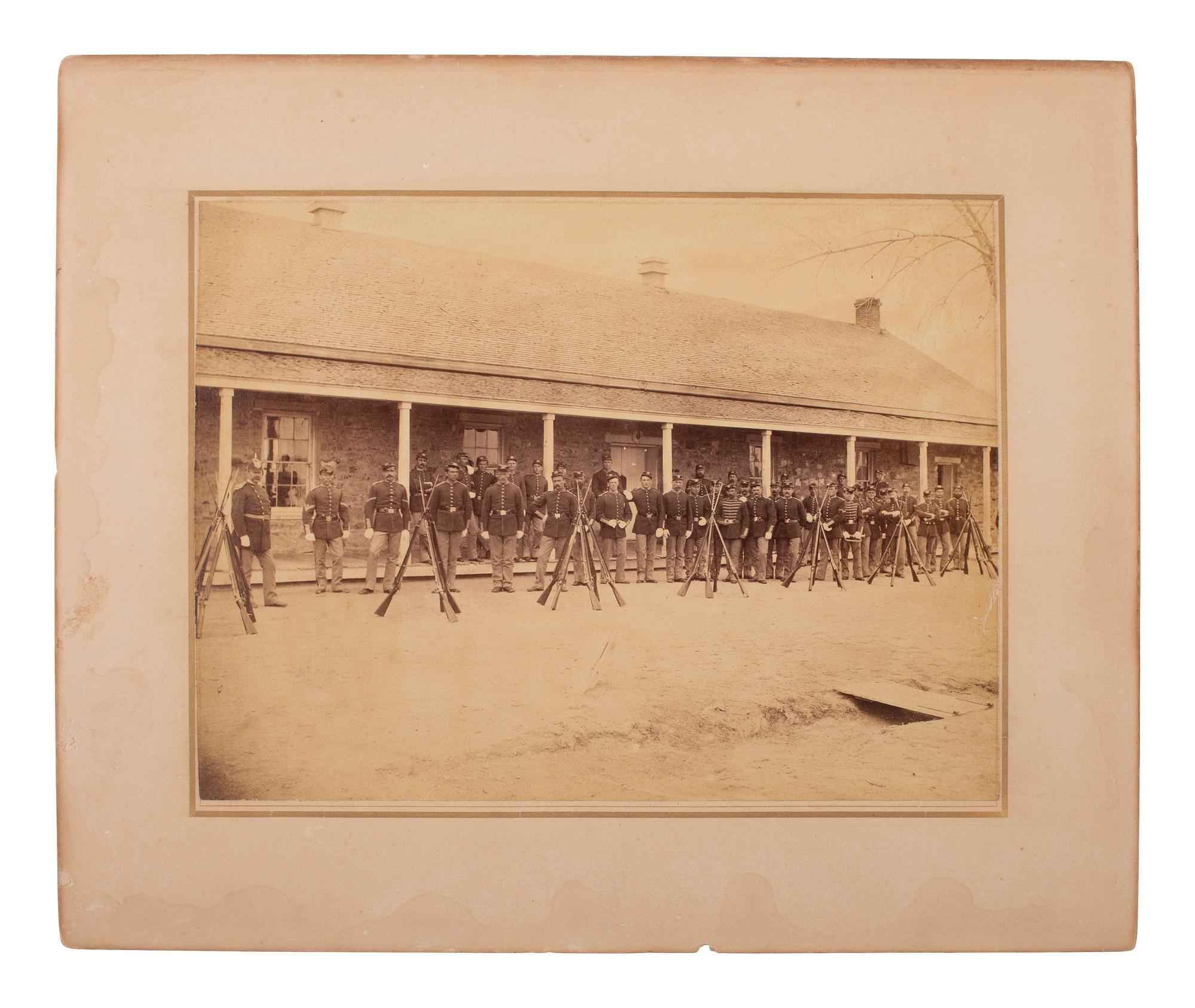 [LATE INDIAN WARS]. [MCKAY, William, photog., attrib.]. 2 photographs of US soldiers near barracks.