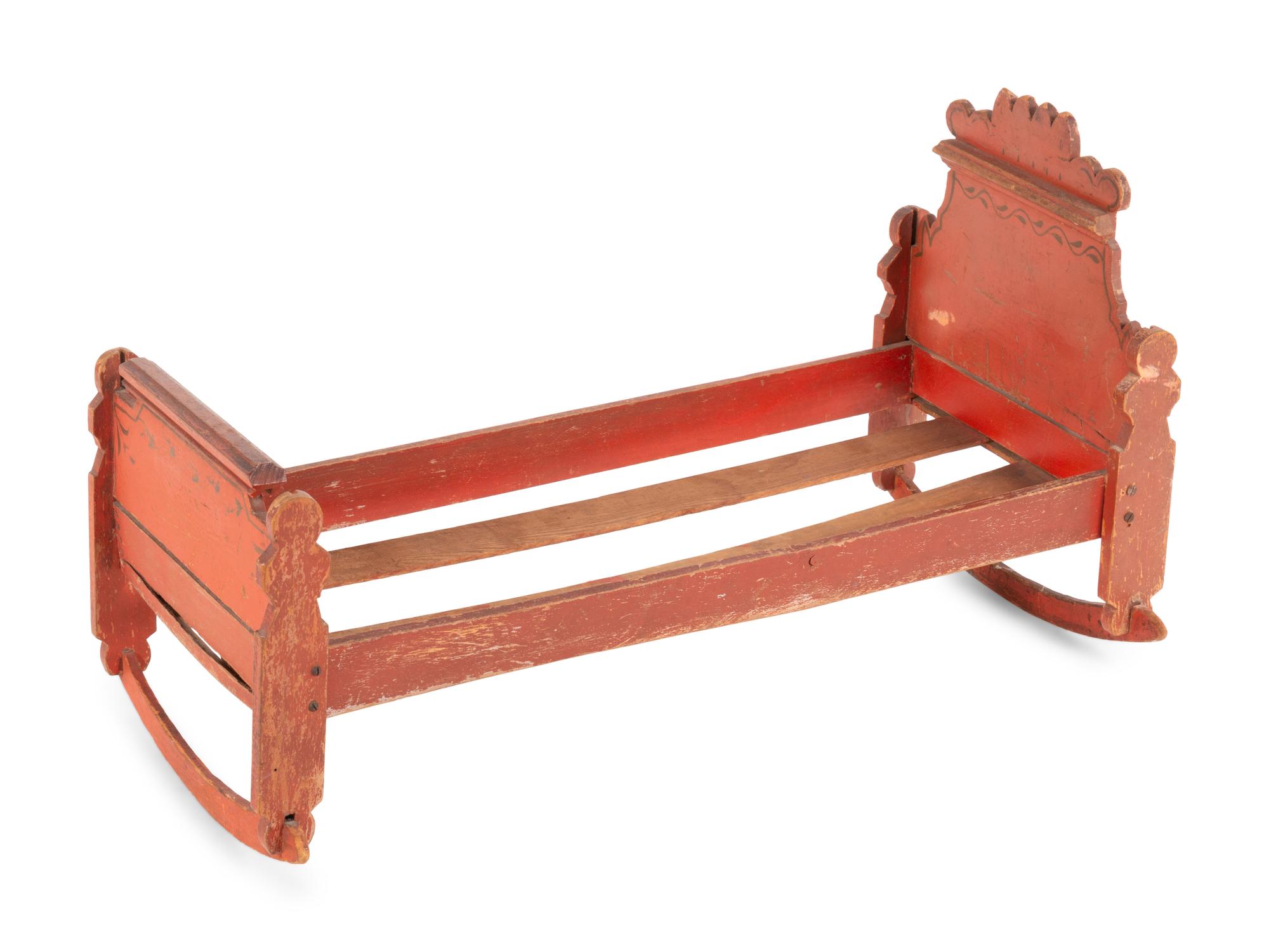 A Scandinavian Painted Pine Doll's Bed