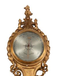 A French Carved Giltwood Clock and Barometer