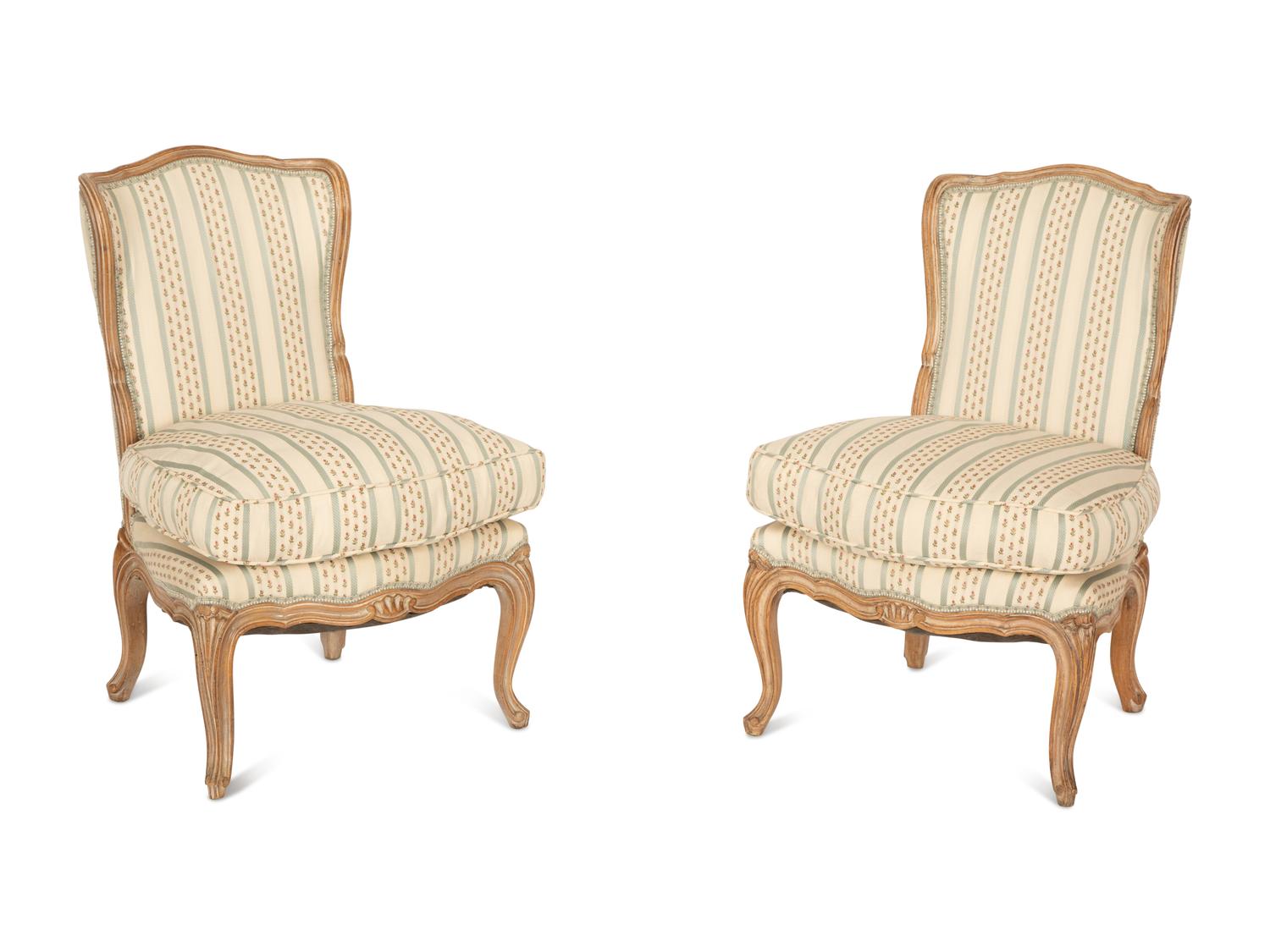 A Pair of Louis XV Style Carved Fruitwood Slipper Chairs