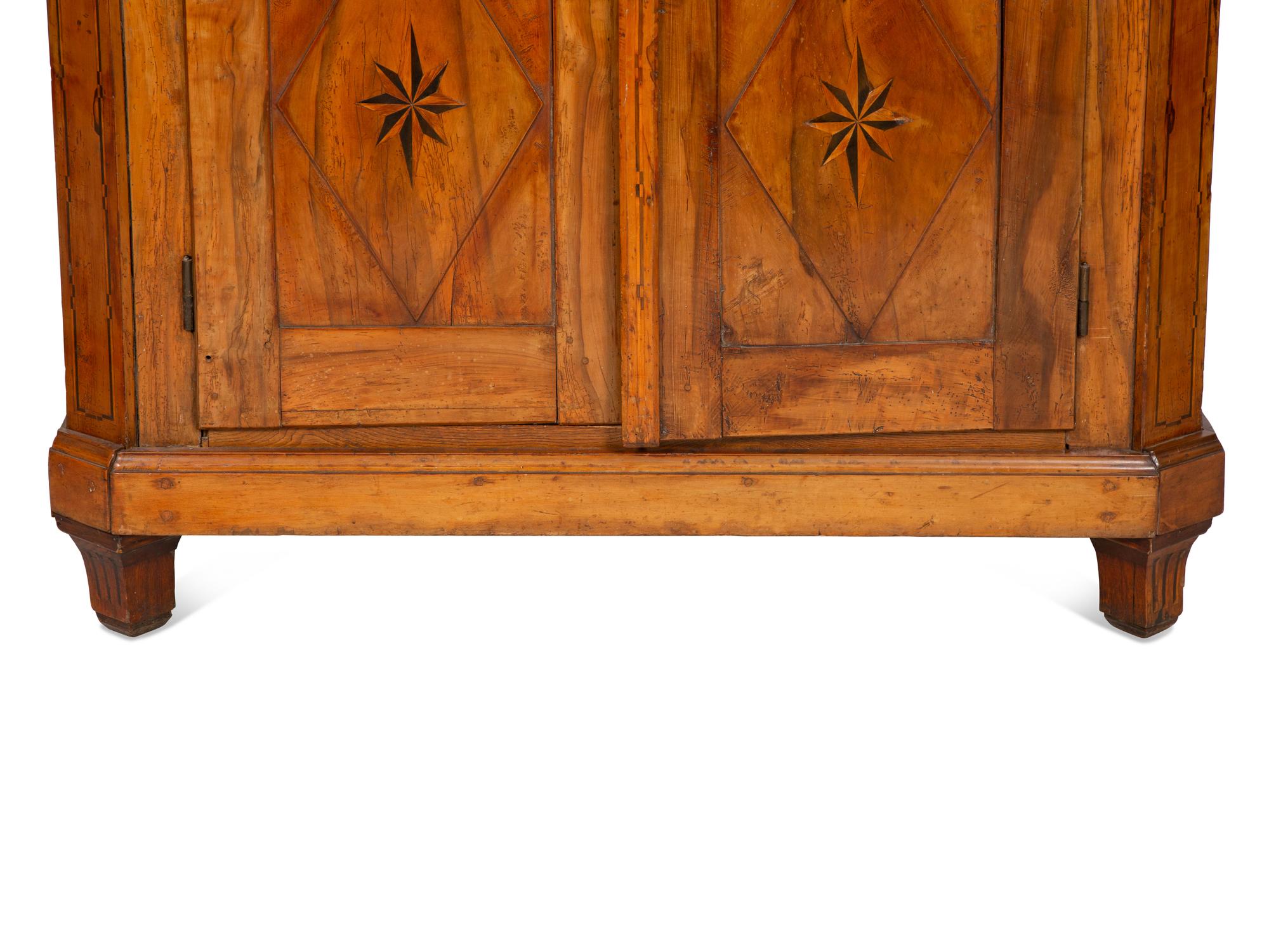 A Continental Olivewood Armoire