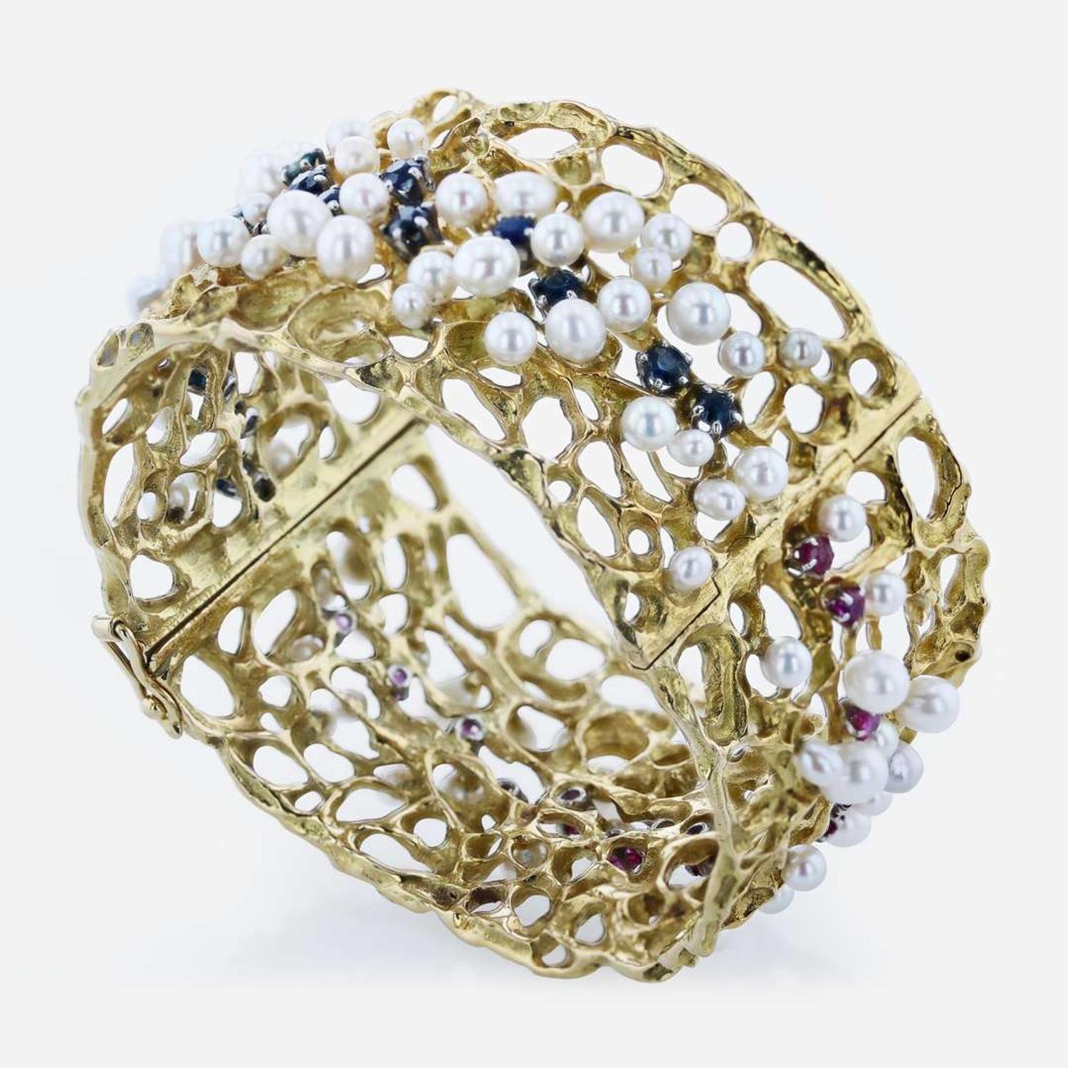 An 18K Yellow Gold and Gemstone Bangle by Karl Stittgen