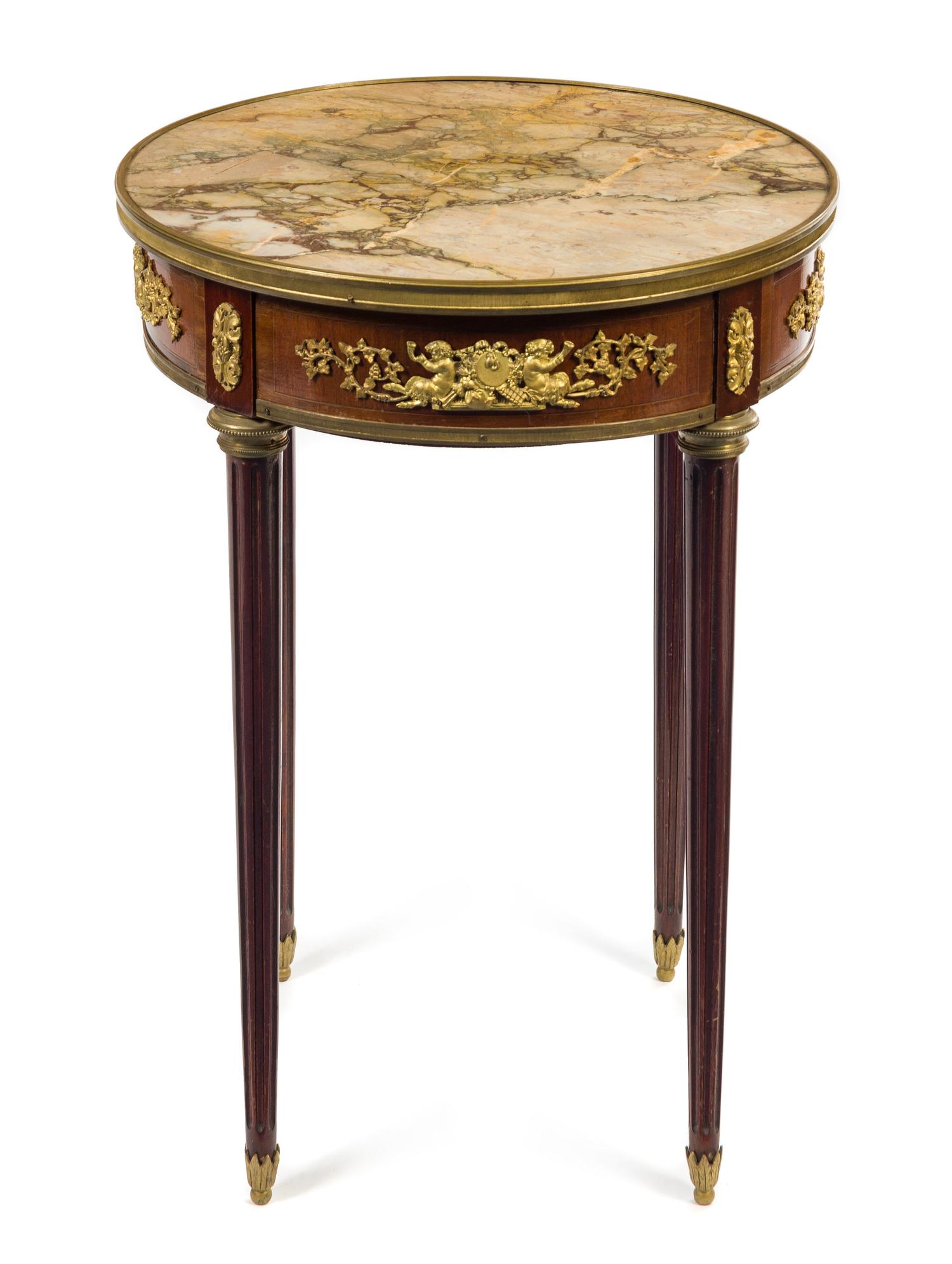 A Louis XVI Style Gilt Bronze Mounted Mahogany Gueridon Height 29 1/2 x diameter of top 20 3/4 inches. — LATE 19TH/EARLY 20TH CENTURY