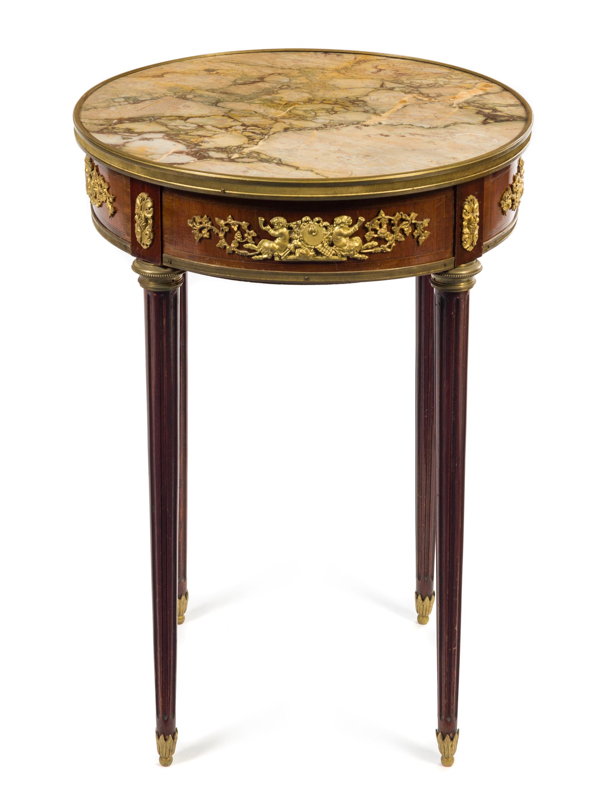 A Louis XVI Style Gilt Bronze Mounted Mahogany Gueridon Height 29 1/2 x diameter of top 20 3/4 inches. — LATE 19TH/EARLY 20TH CENTURY