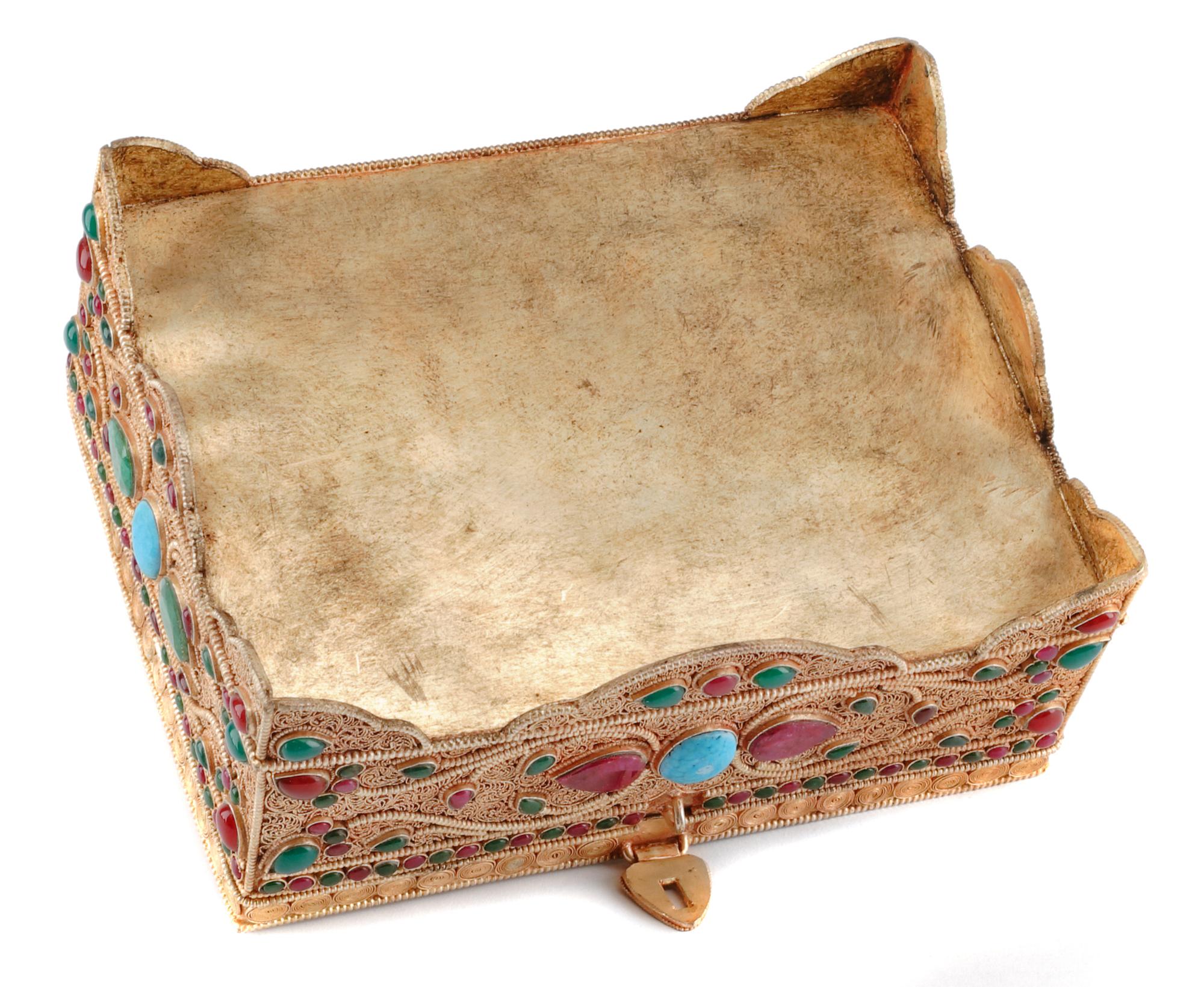 A Silver Filigree and Semi-Precious Stone-Inset Box, 20th Century, of rectangular form with stylized floral decoration.