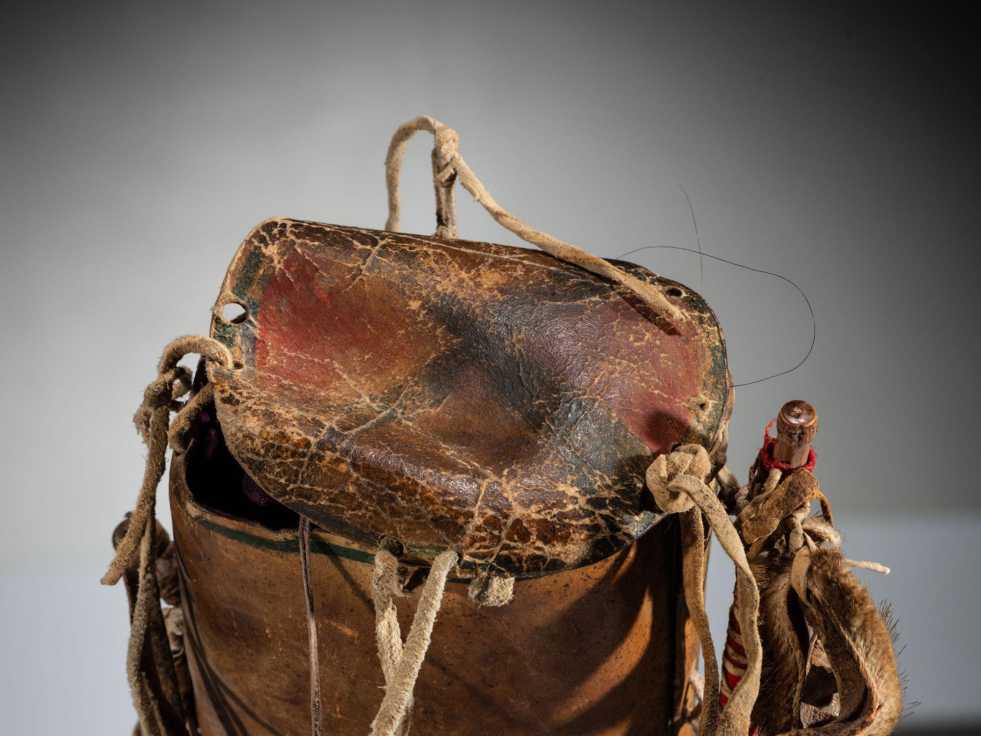Apsáalooke Painted Parfleche Cylinder, with Horse Charm