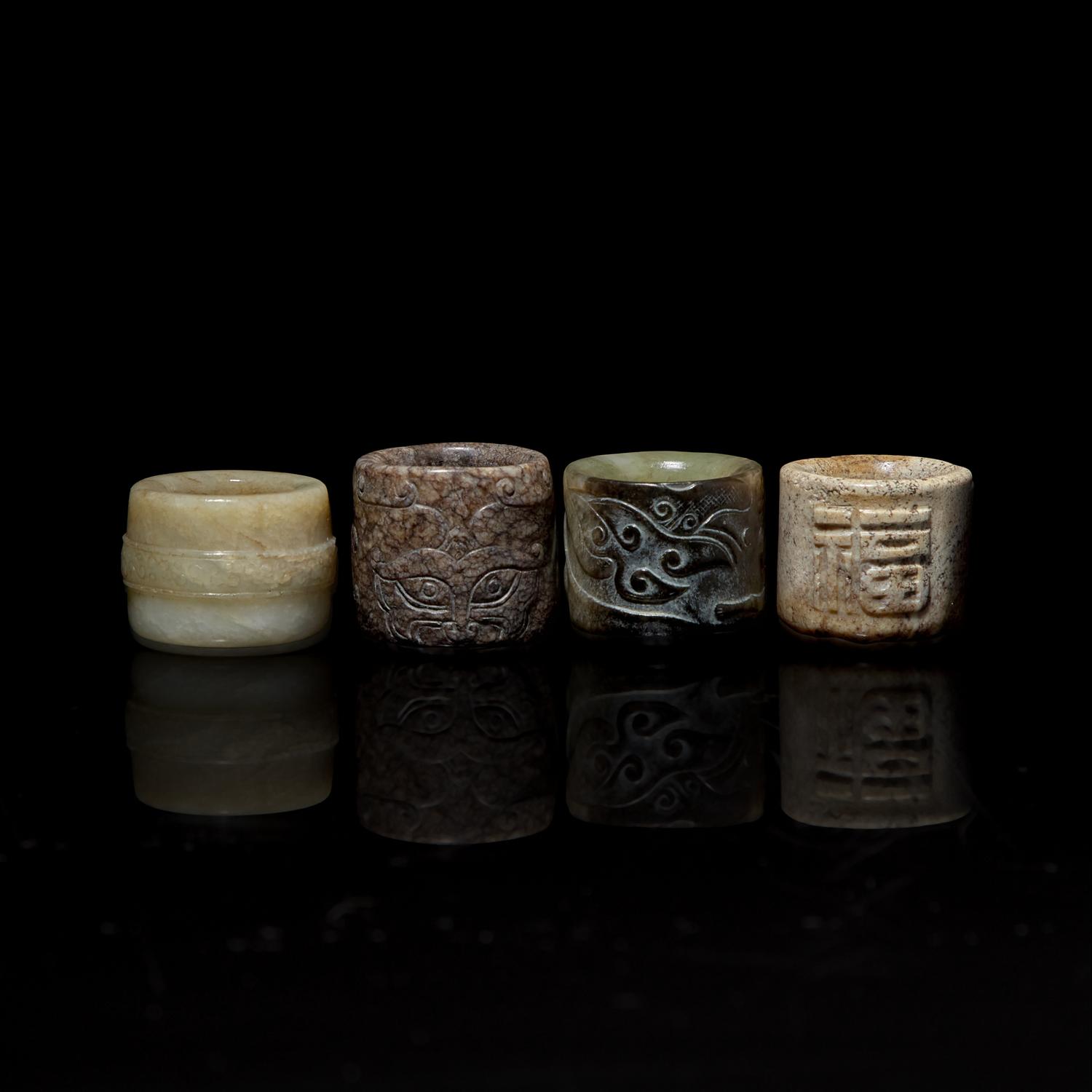 Four Chinese Carved Russet and Brown Jade Archer's Rings 帶沁灰玉扳指一組四枚