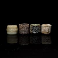 Four Chinese Carved Russet and Brown Jade Archer's Rings 帶沁灰玉扳指一組四枚