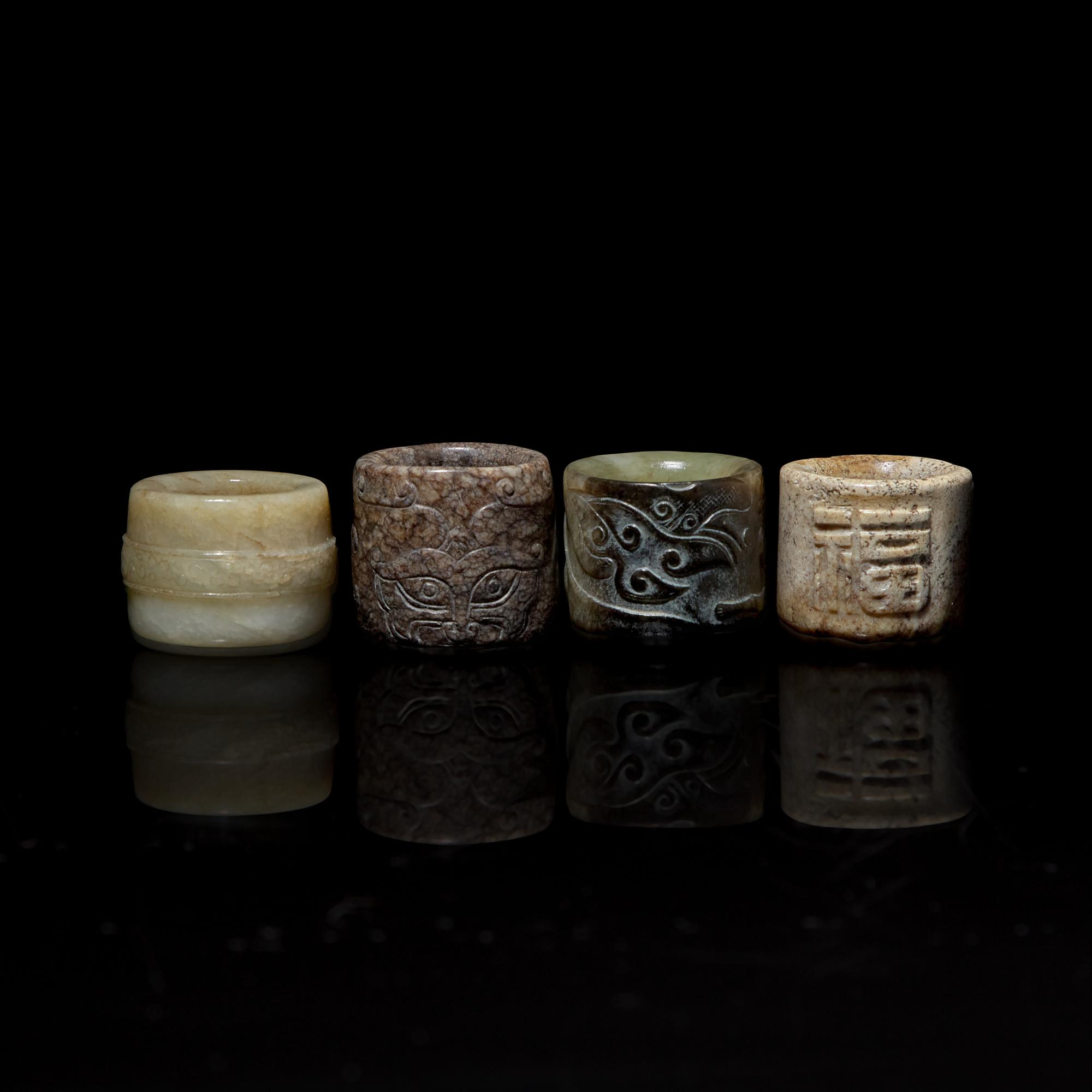 Four Chinese Carved Russet and Brown Jade Archer's Rings 帶沁灰玉扳指一組四枚