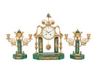 A Gilt Bronze and Malachite Veneered Clock Garniture