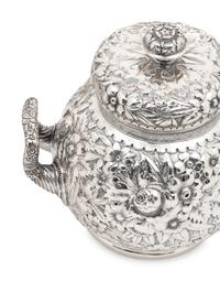 A Tiffany and Co. Silver Repoussé Five-Piece Tea and Coffee Service