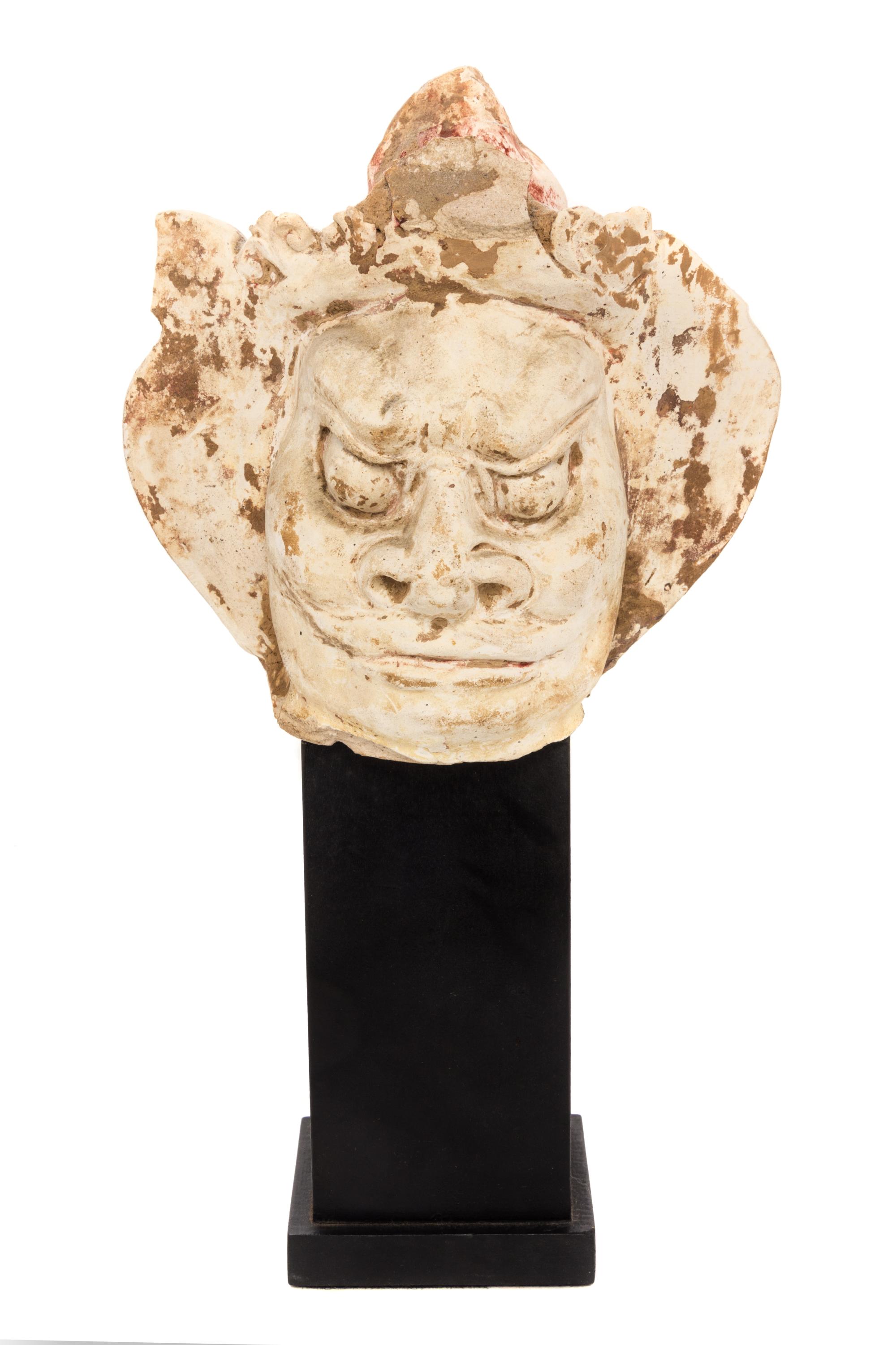 A Chinese Painted Pottery Head of a Guardian Height 5 1/2 inches. — LIKELY TANG DYNASTY