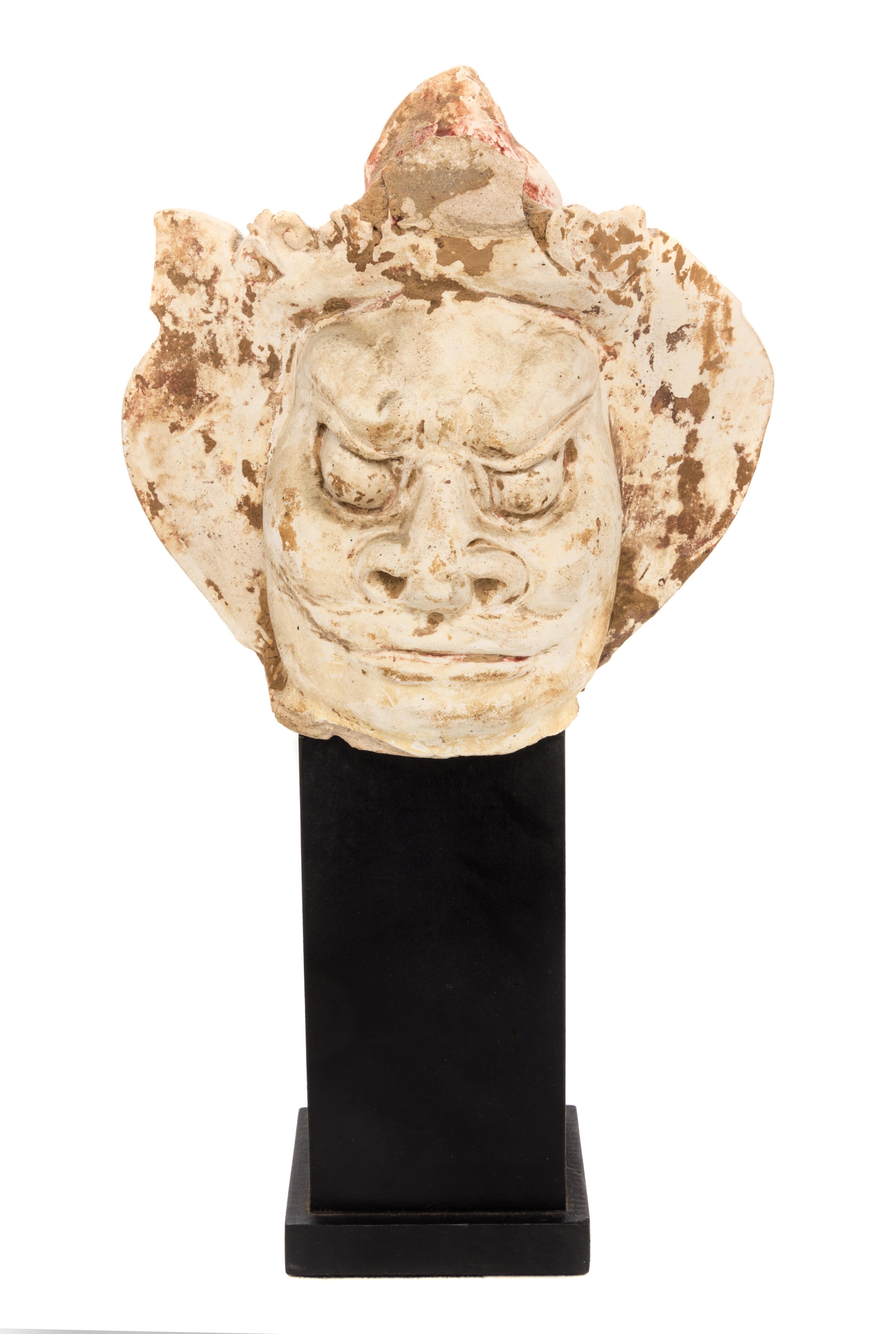 A Chinese Painted Pottery Head of a Guardian Height 5 1/2 inches. — LIKELY TANG DYNASTY