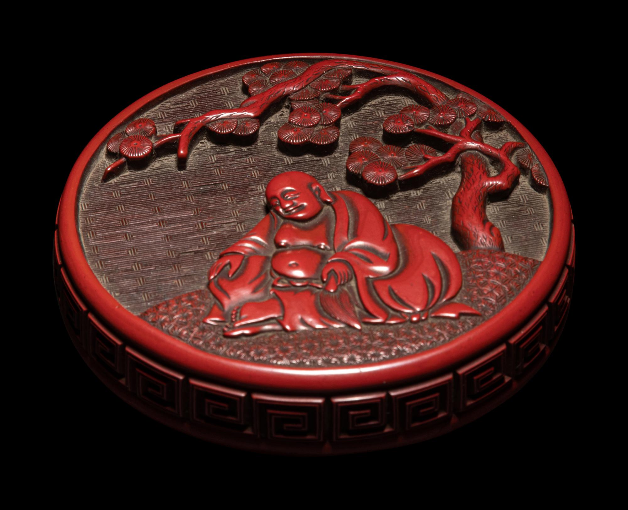 A Carved Cinnabar Lacquer 'Luohan' Circular Covered Box