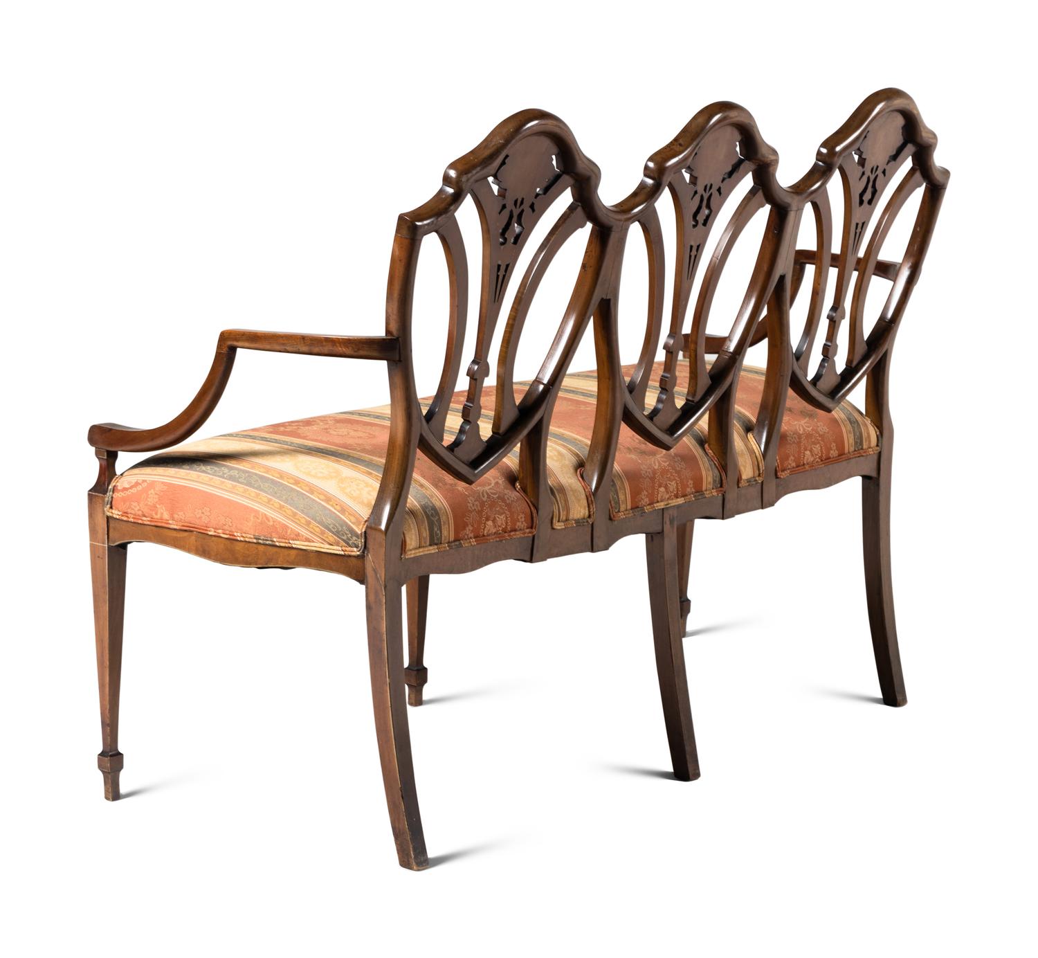 An Edwardian Painted Satinwood Triple-Back Settee and Armchair