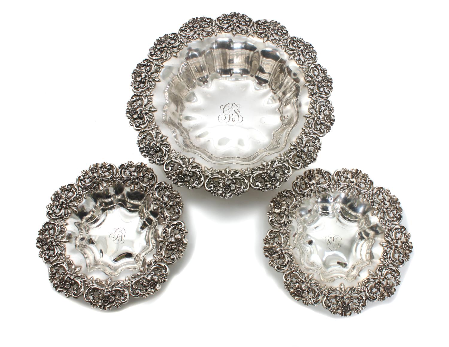 Three American Silver Baskets, Possibly Redlich & Co., New York, NY, each having floral border, lobbed bowl and center monogram.