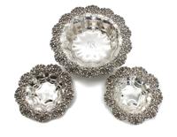 Three American Silver Baskets, Possibly Redlich & Co., New York, NY, each having floral border, lobbed bowl and center monogram.