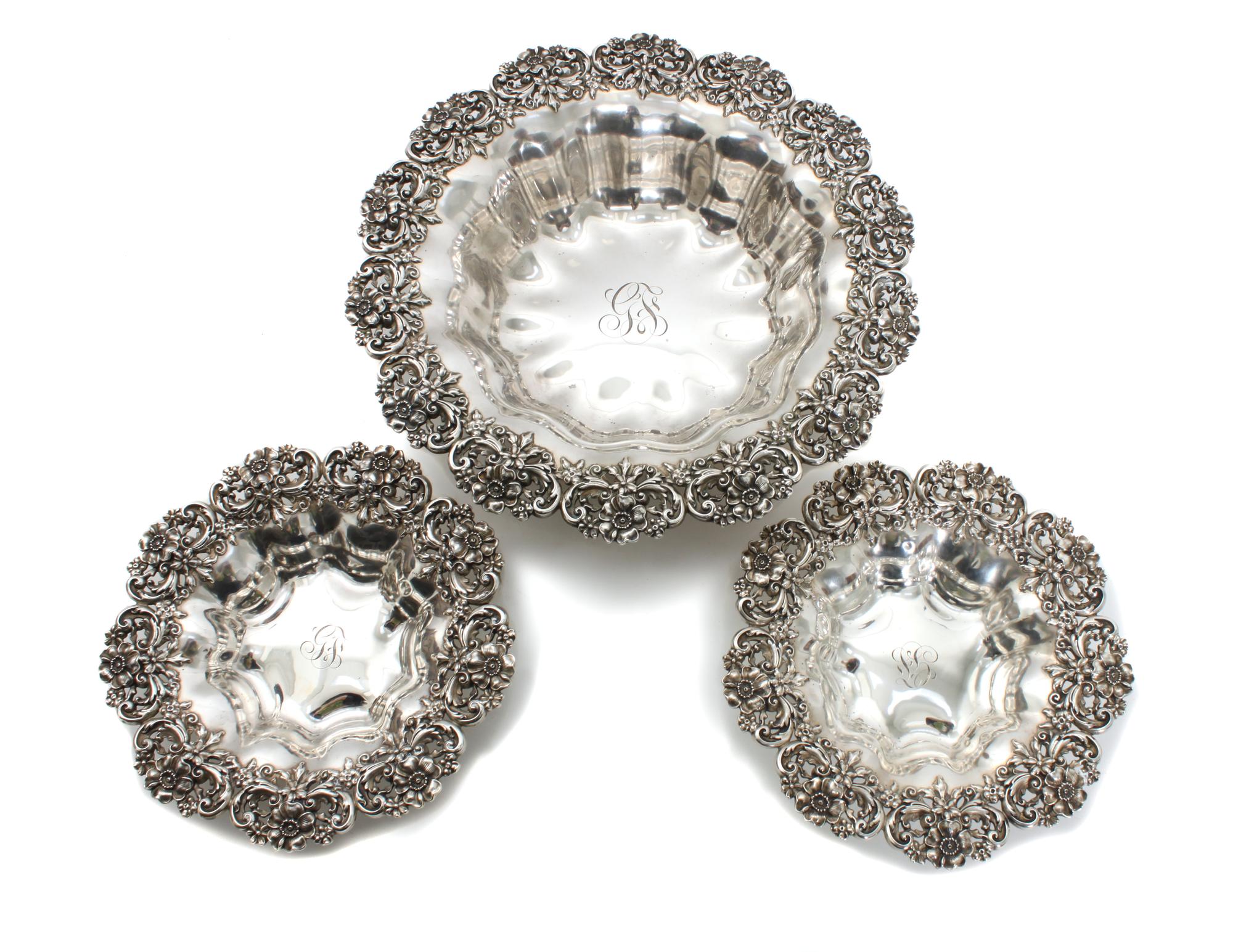 Three American Silver Baskets, Possibly Redlich & Co., New York, NY, each having floral border, lobbed bowl and center monogram.