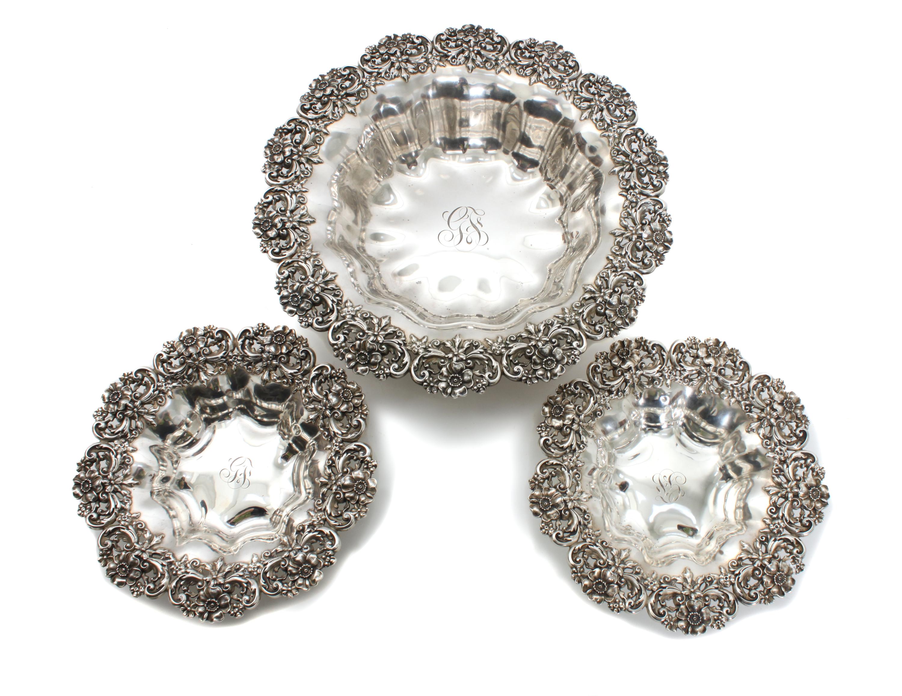 Three American Silver Baskets, Possibly Redlich & Co., New York, NY, each having floral border, lobbed bowl and center monogram.