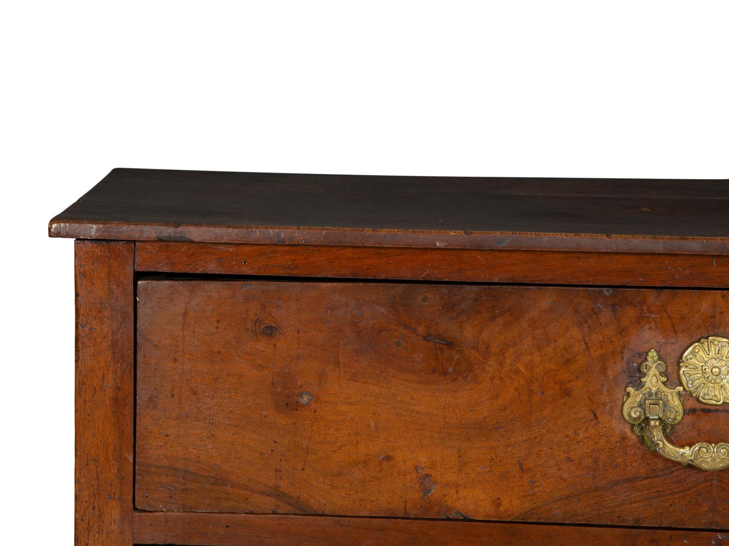 A Continental Walnut Two-Drawer Commode