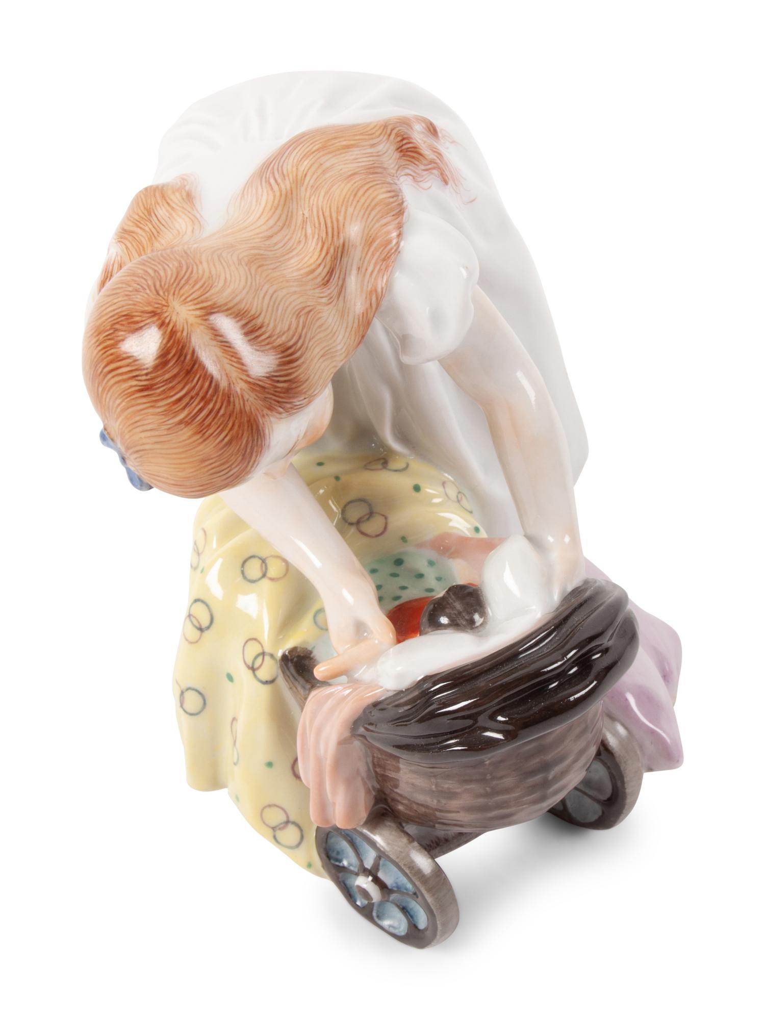 A Meissen Porcelain Figure of a Girl with a Doll Stroller, by Konrad Hentschel