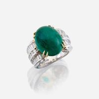 An emerald, diamond, and eighteen karat white gold ring