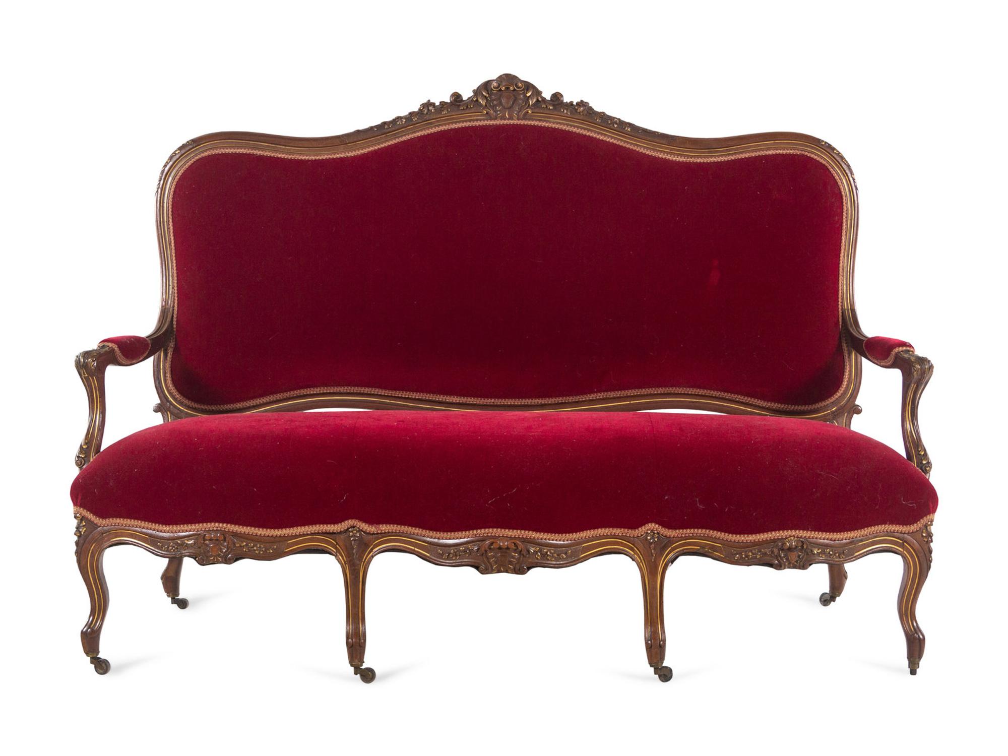 An Italian Louis XV Style Carved and Parcel Gilt Walnut Parlor Suite